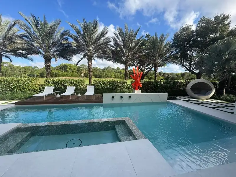 Exterior custom home at dusk in Palm Beach County, FL — JN Builders